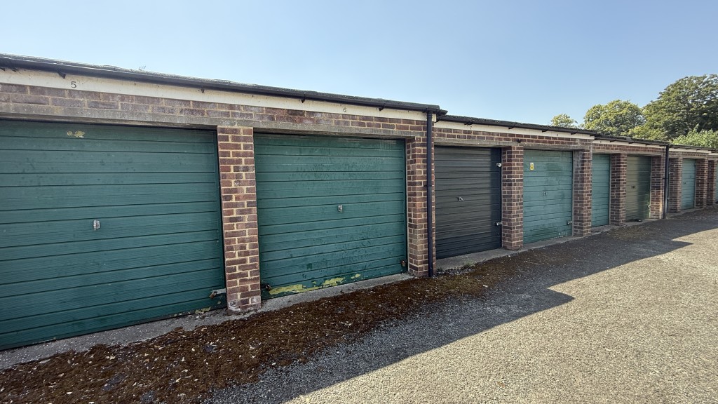 Lot: 87 - VACANT TWO-BEDROOM GROUND FLOOR FLAT IN CONVENIENT RESIDENTIAL LOCATION - External view of garage in block